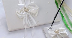Remedios Boutique 2-Piece Bridal Accessory Set of White Bow Satin Guest Book and Pen with Pen Holder