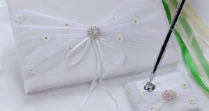 Remedios Boutique 2-Piece Bridal Accessory Set of White Satin Guest Book and Pen with Pen Holder with Embroidered Bow